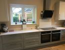 grey handled kitchen by blue design kitchens