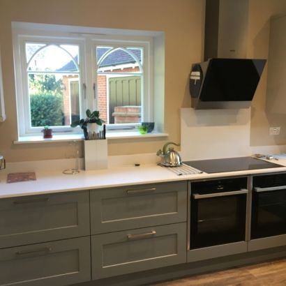 grey handled kitchen by blue design kitchens