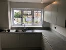 grey handleless kitchen by blue design kitchens