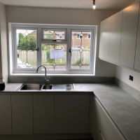 grey handleless kitchen by blue design kitchens